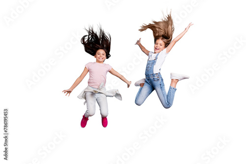 Full length body size view of two people nice crazy attractive cheerful carefree careless straight-haired pre-teen girls having fun great cool day free time overjoy isolated on blue background