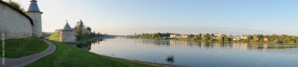 Pskov, Russia, September 11, 2023. Autumn panoramic view of the river and the walls of the fortress. Pskov, Russia, September 11, 2023. Autumn panoramic view of the river and the walls of the fortress.