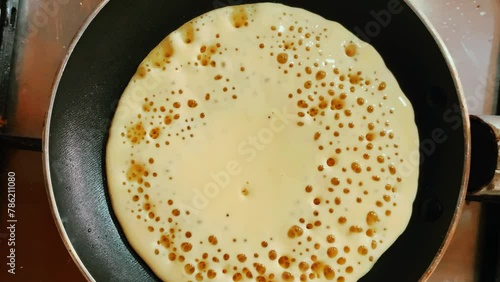 top view of a moroccan beghrir in a pan , the  Moroccan beghrir are spongy semolina pancakes which are cooked only on one side.  photo