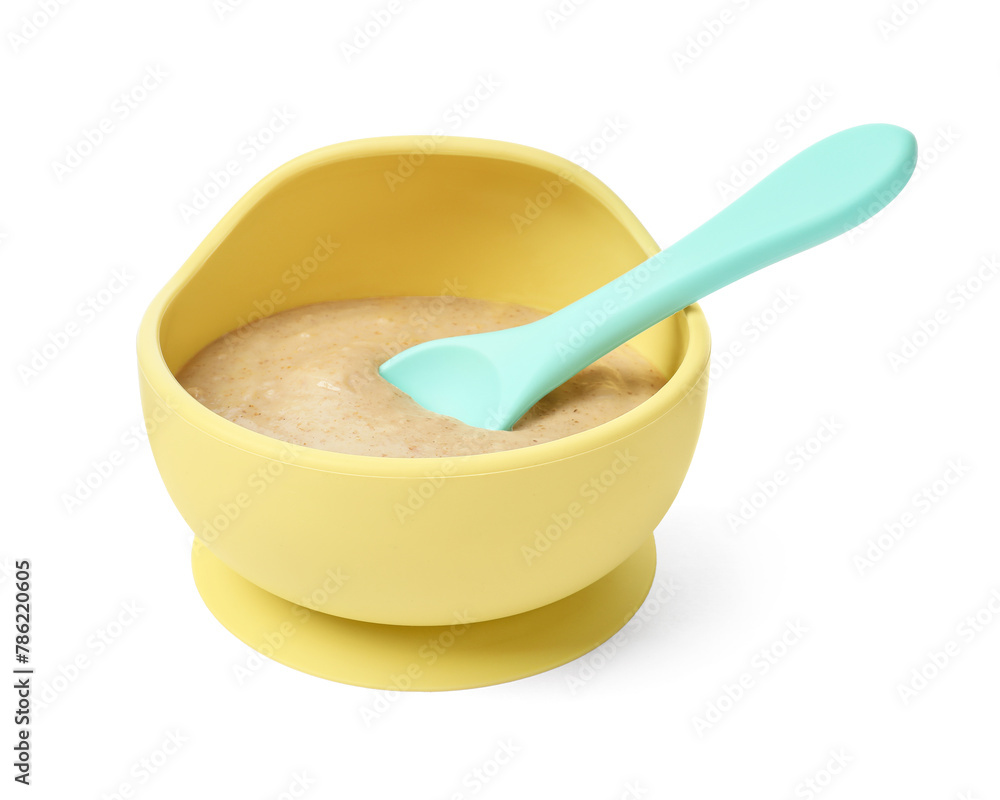 Tasty baby food and spoon in bowl isolated on white Tasty baby food and spoon in bowl isolated on white