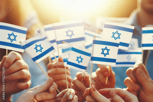 A group people holding up flags with the word Israel on them