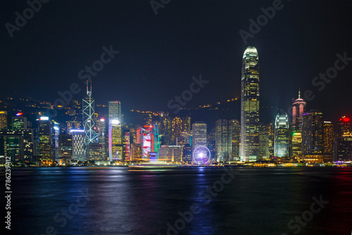 Banking district of Hong Kong illuminated at dusk with Ferris wheel