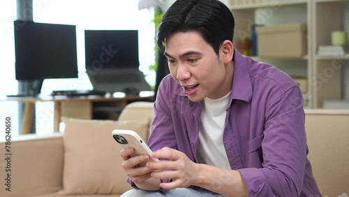 Young Asian man at home