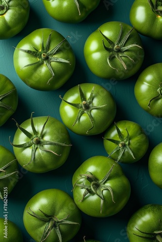 Fresh green tomatoes on a vibrant blue background top view flat lay photo of organic summer vegetables in vivid colors