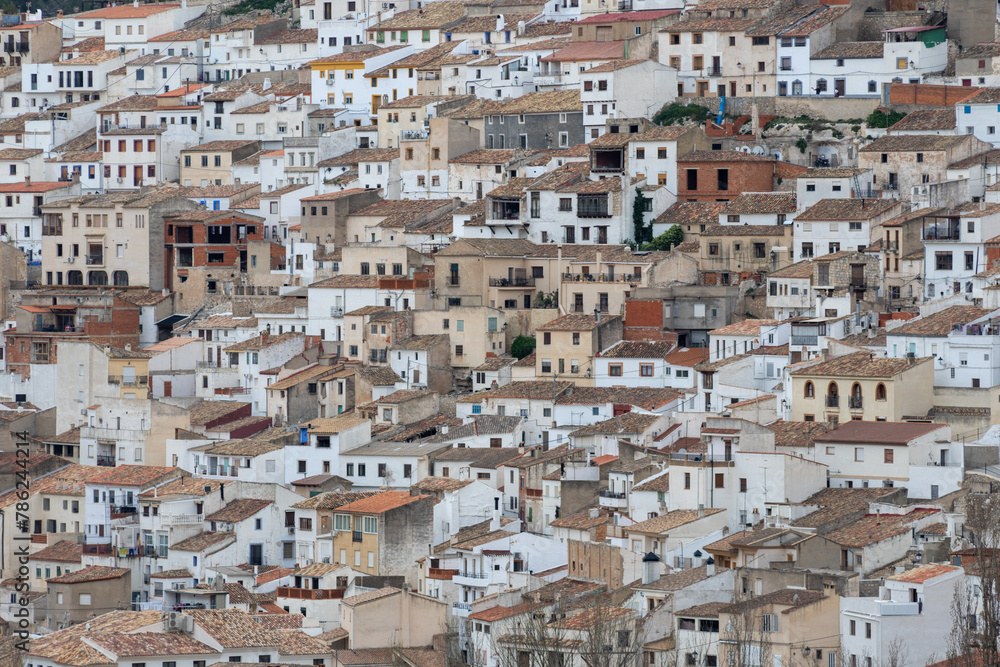 Panoramic view of the town of Alcalá del jucar from Las Eras viewpoint. Its popular cave houses, carved into the mountain, the castle and Church of San Andrés in the gorge of the jucar river, Albacete