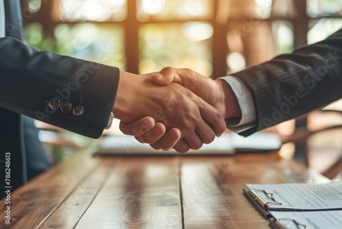 Shake hands with a businessman in the office and conduct business during a meeting.