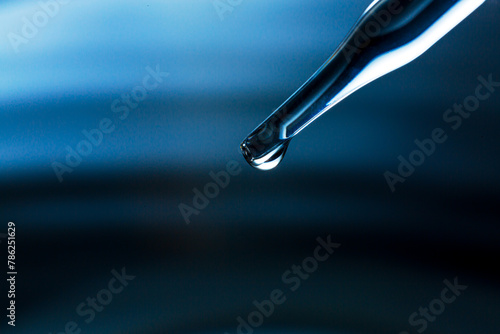 Water droplets macro science experiment,Liquid drop from laboratory glass Pipette