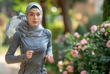 Middle eastern woman in tracksuit and turban promotes healthy lifestyle and inclusivity
