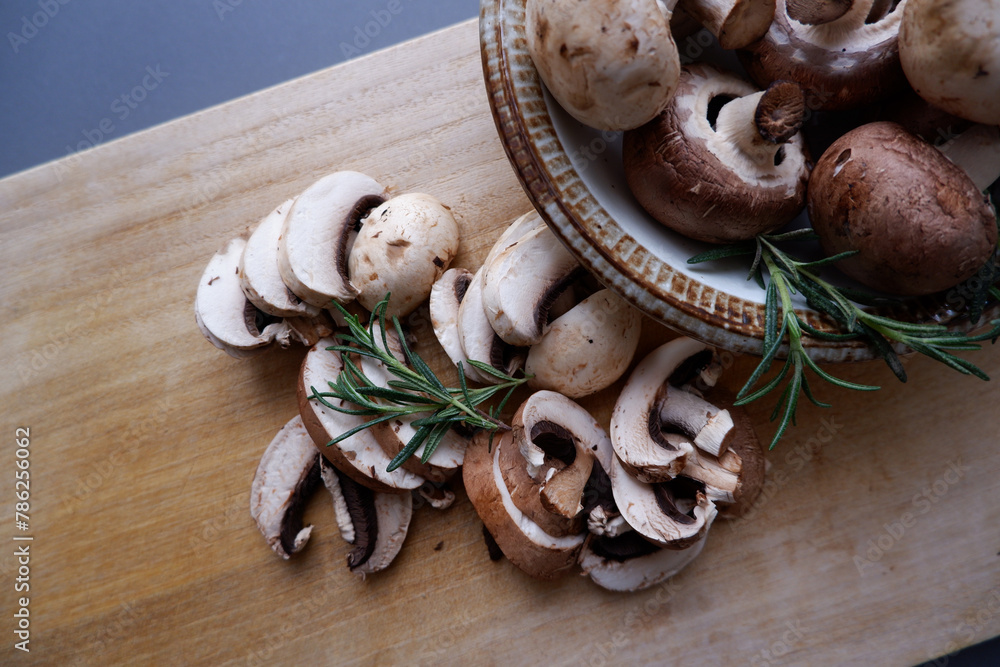 Champignon mushroom on the wooden table. healthy food concept decoration background. Mushrooms composition on wooden plate. Champignon mushroom on the wooden table. healthy food concept decoration background. Mushrooms composition on wooden plate.