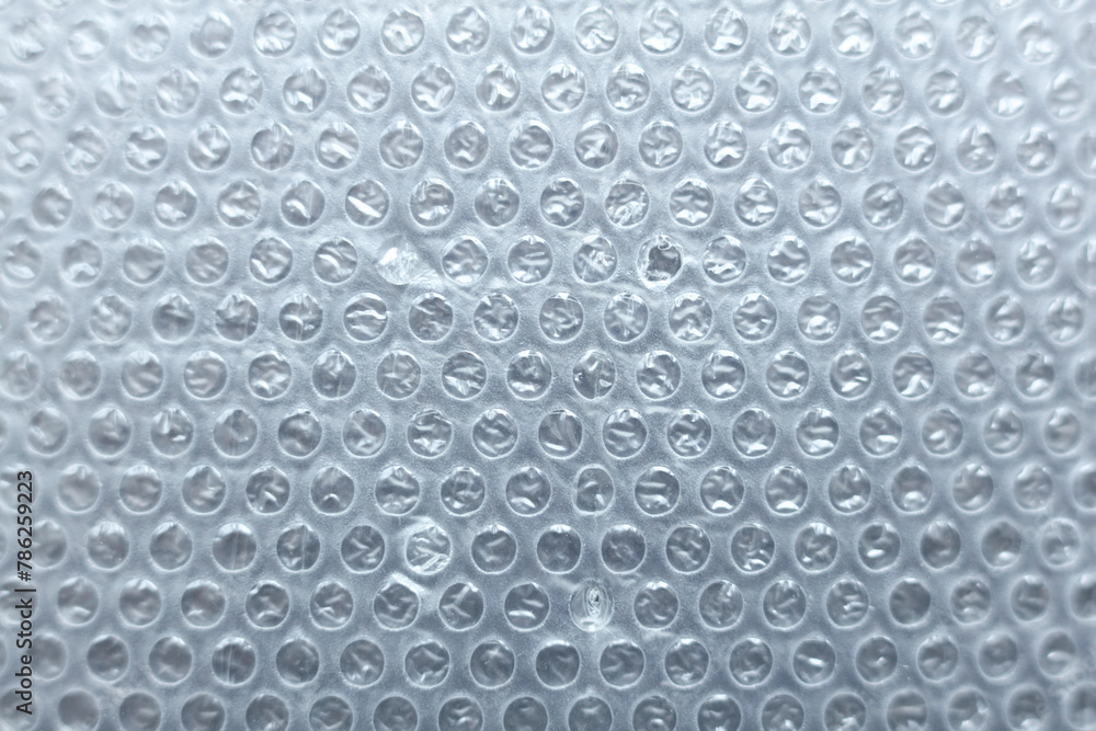 Close-up of a sheet of plastic wrap with bubbles. Abstract background. Close-up of a sheet of plastic wrap with bubbles. Abstract background.