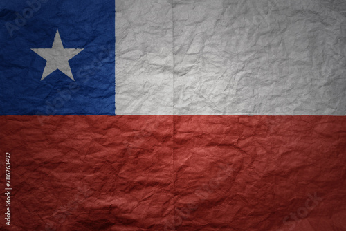 big national flag of chile on a grunge old paper texture background