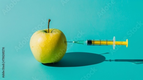 Science experiment with apple and syringe, concept of GMO and toxic food.	