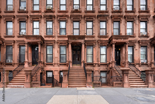 Harlem Brownstones with stoop steps in Mount Morris Park Historic District. Row of Townhouses in Manhattan, New York City