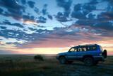 Twilight Landscape with Parked SUV. SUV parked in a remote grassland at sunset, ideal for travel and adventure themes.