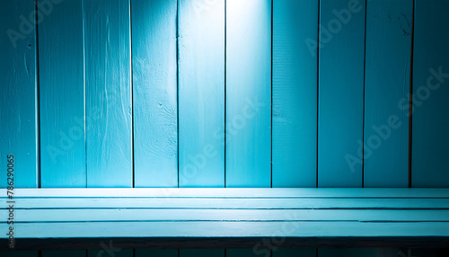 Vintage Wooden Interior: Light Blue wood table and bench, the lighting is strong in the middle, the light decreases towards the edges. Old planks wall and table with empty space and showroom