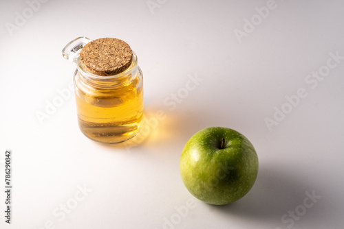 apple vinegar in a jar on white