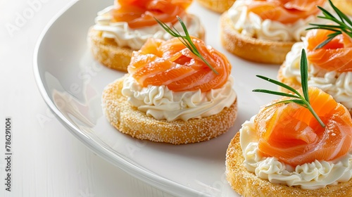 Plate of smoked salmon and cream cheese appetizers on a white dish