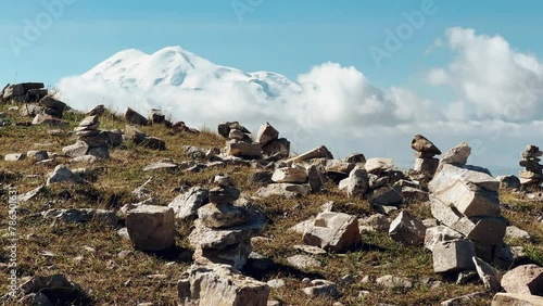 View of Elbrus from the Bermamyt plateau. Caucasus 2023. A trip to Bermamyt, the Grand Canyon in Russia. Mountain landscape on a summer day. Blue sky of Karachay-Cherkessia. Caucasian Ridge 4K photo