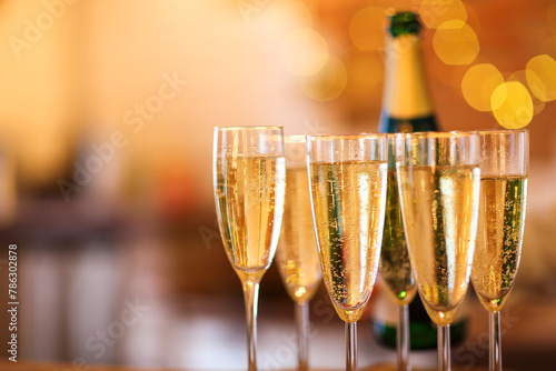 Champagne glasses on gold background. Party concept