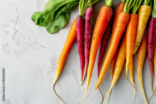 colorful carrots on a white table, top view