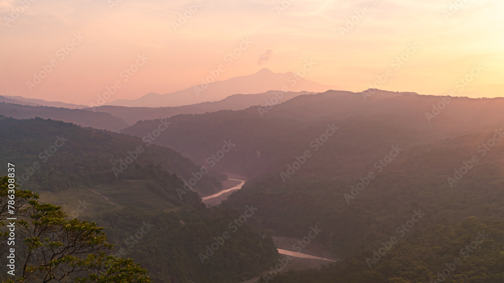 Colorful sunset with a valley and mountains in the Andes mountain range