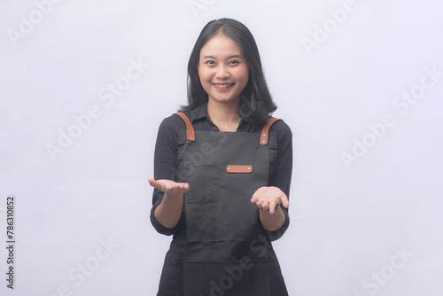 Young Asian Woman Barista Wearing Apron