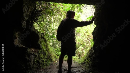 A man in a cave in the Laurisilva forest of Los tilos de Moya, Gran Canaria photo