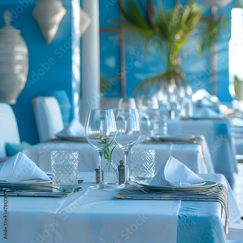 table setting in the restaurant interior light blue tones mediterranean style.