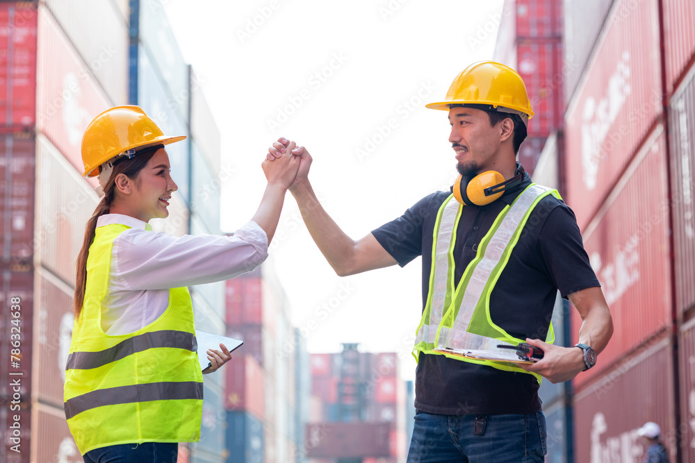 Portrait of an engineer checking products at an industrial container yard.