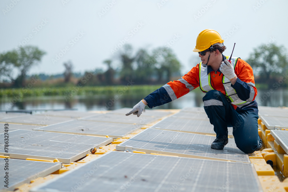 Solar Field Technician Examining Panel Efficiency Solar Field Technician Examining Panel Efficiency