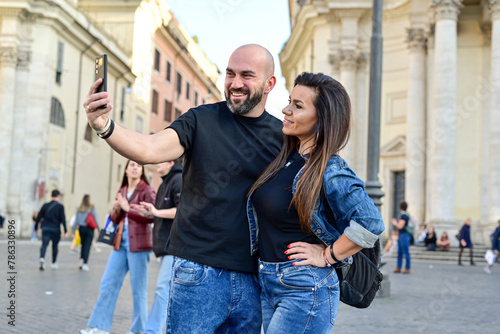 Happy  Beautiful Tourists  couple traveling at Rome  Italy  taking a selfie portrait Visiting Italy - man and woman enjoying weekend vacation - Happy lifestyle concept 