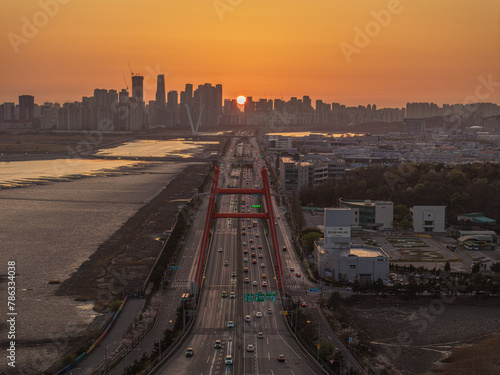 Sunset view and cars using the highway 