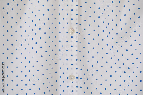 Full frame of Buttons down shirt.close up.polka dot background.
