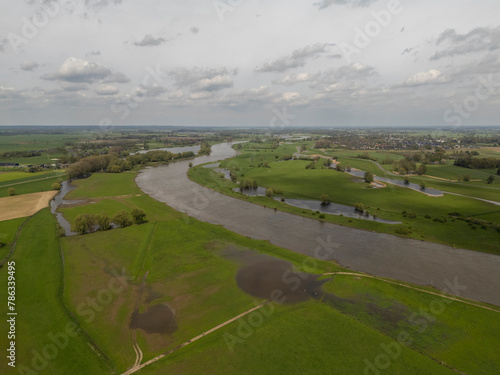 Aerial View: Countryside Road along the IJssel River Dike in Netherlands (ID: 786339495)