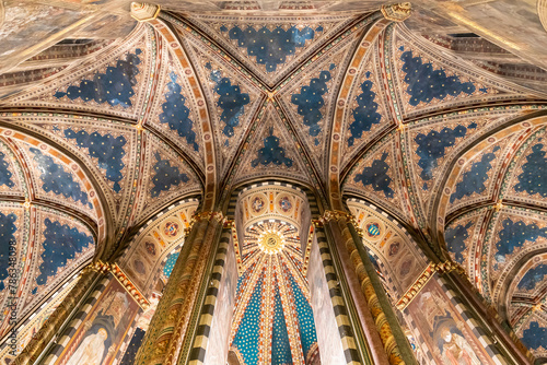 Close-up on complex ceiling structure of gothic cathedral in Italy