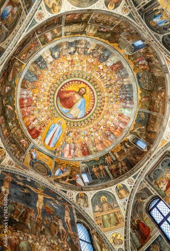 View of medieval frescos decorating the dome ceiling of catholic cathedral in Italy