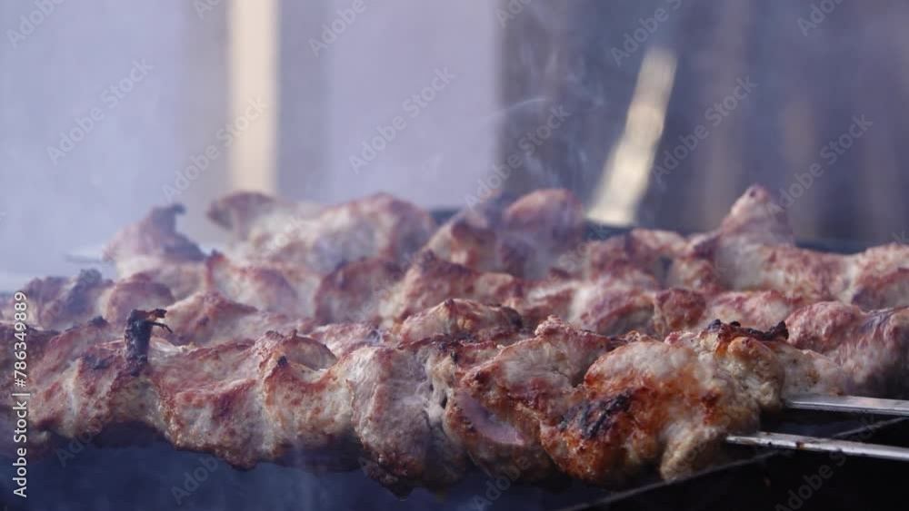 Man fries delicious meat barbecue on grill. Man fries delicious meat barbecue on grill.