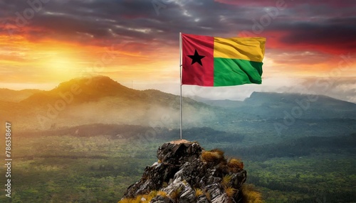 The Flag of Guinea  Bissau On The Mountain. photo