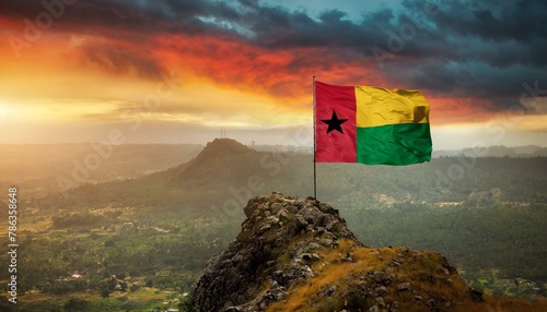 The Flag of Guinea  Bissau On The Mountain. photo