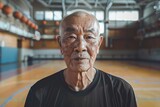 Portrait of a senior asian man in indoor basketball gym
