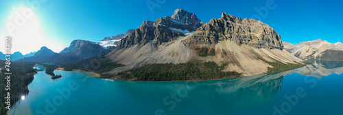 Panoramic aerial view of Crowfoot Mountain in autumn with snow.