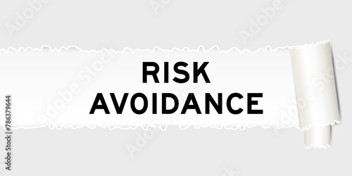 Ripped gray paper background that have word risk avoidance under torn part