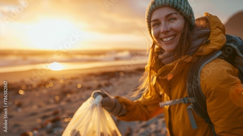 A woman smiles as she holds a plastic bag filled with litter collected from the beach, showcasing her volunteer efforts to clean up the environment