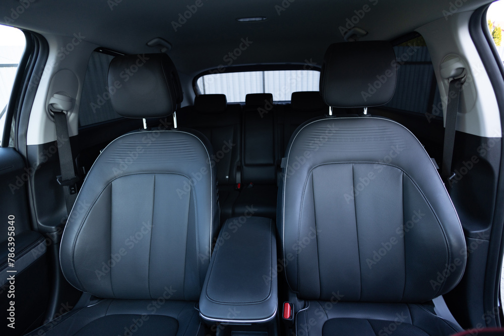 Luxury car leather seats. Interior of new modern clean expensive car. Passenger seats with leather. Closeup details. New car inside. Car cleaning theme Luxury car leather seats. Interior of new modern clean expensive car. Passenger seats with leather. Closeup details. New car inside. Car cleaning theme