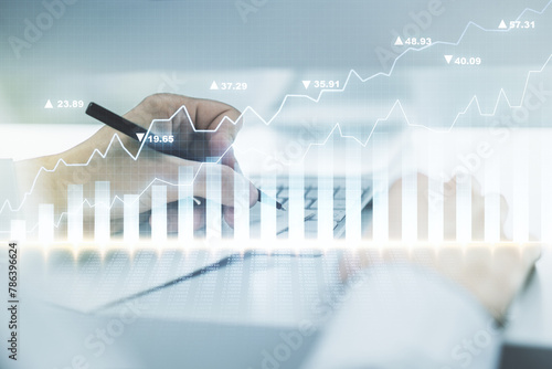 Multi exposure of abstract creative financial graph with hand writing in notepad on background, forex and investment concept © Pixels Hunter