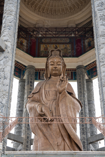 The Buddha Statue of the Chinese Buddhist Temple Kek Lok Si to the City of George Town on Penang in Malaysia
