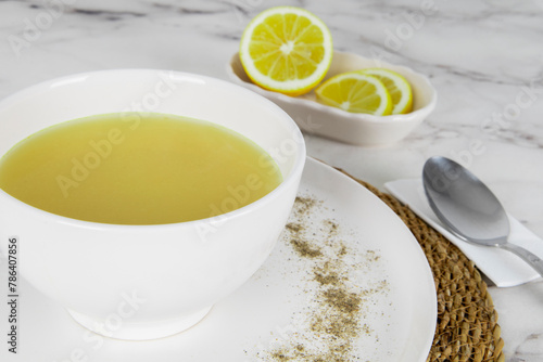 Lentil soup with lemon. Turkish soup Mercimek çorbası limon dilimleri