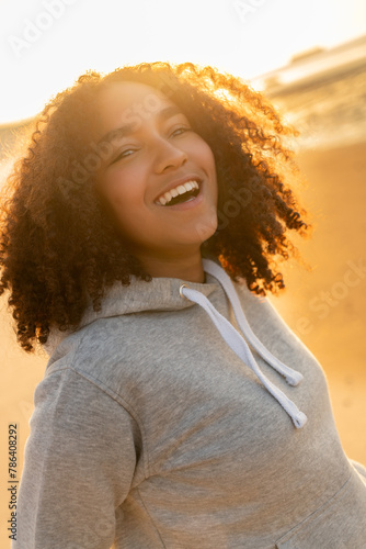 Mixed Race African American Girl Teenager Smiling on Beach at Sunset