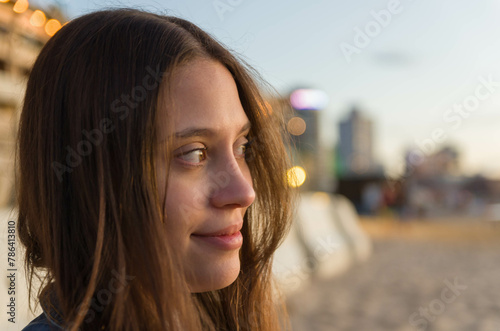 beautiful young woman looking to the side on Uruguayan beach