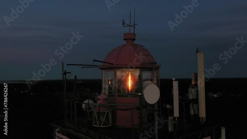 Red Hill Lighthouse, Russia. Calm and magical sunset at the picturesque cape. photo